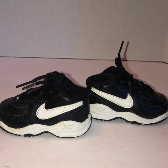 black nike with white check